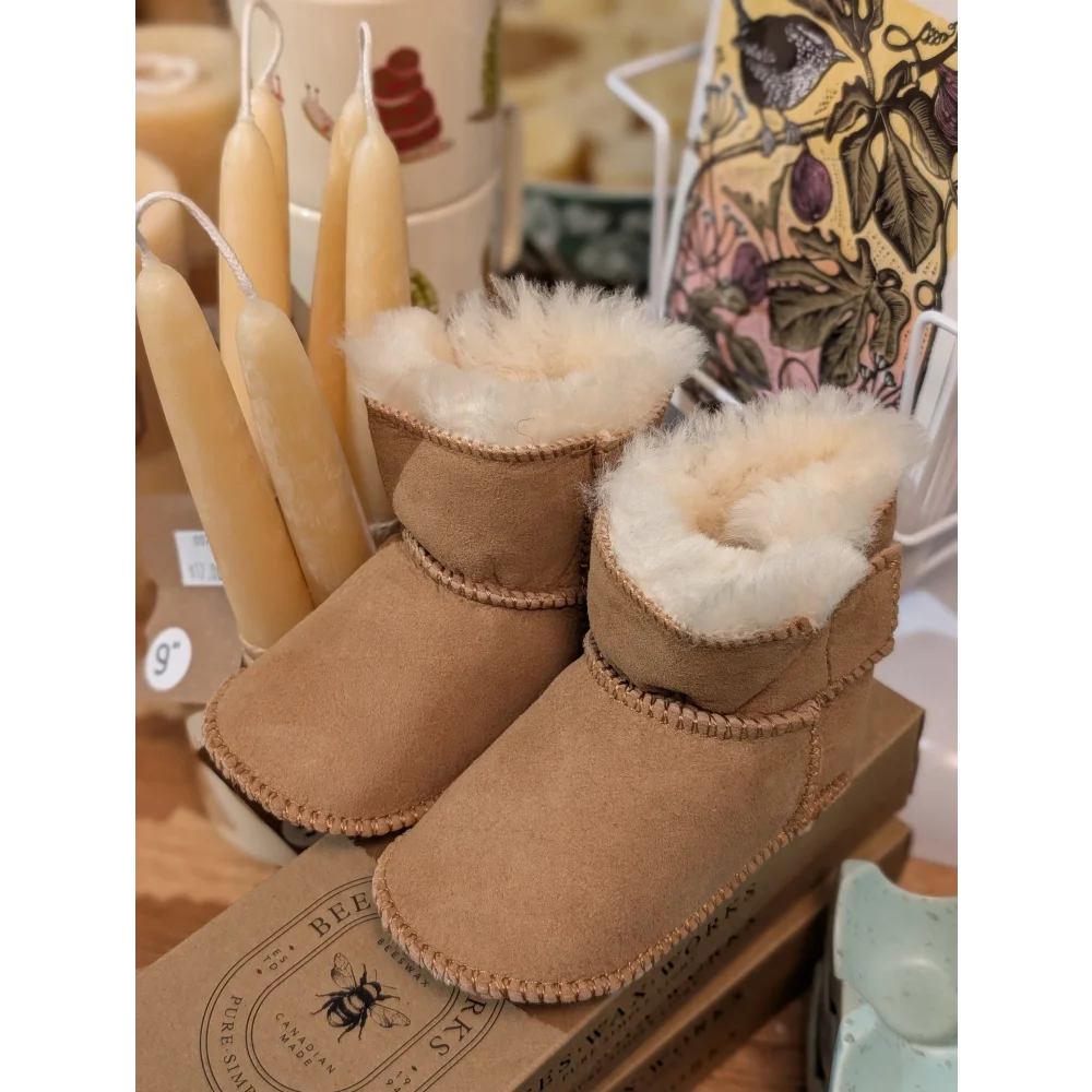 Cute tan UGG sheepskin baby booties with fur lining, ten pairs