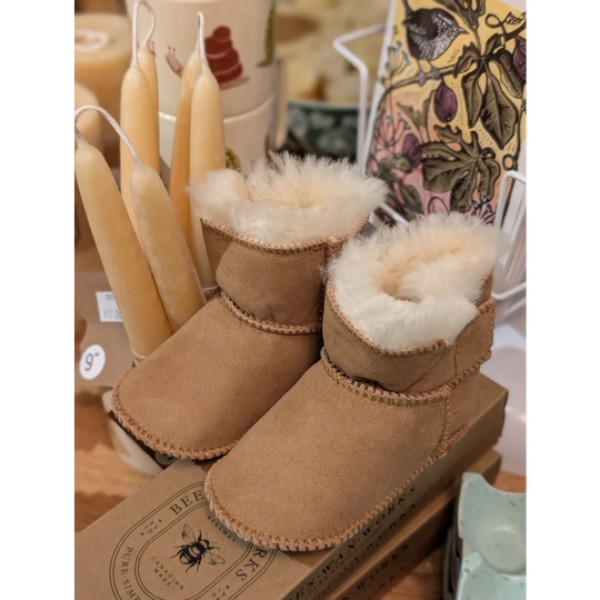 Cute tan UGG sheepskin baby booties with fur lining, ten pairs