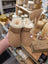 Tan UGG sheepskin baby booties with white fur lining