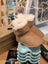 Tan sheepskin baby booties with fur lining and wave soles
