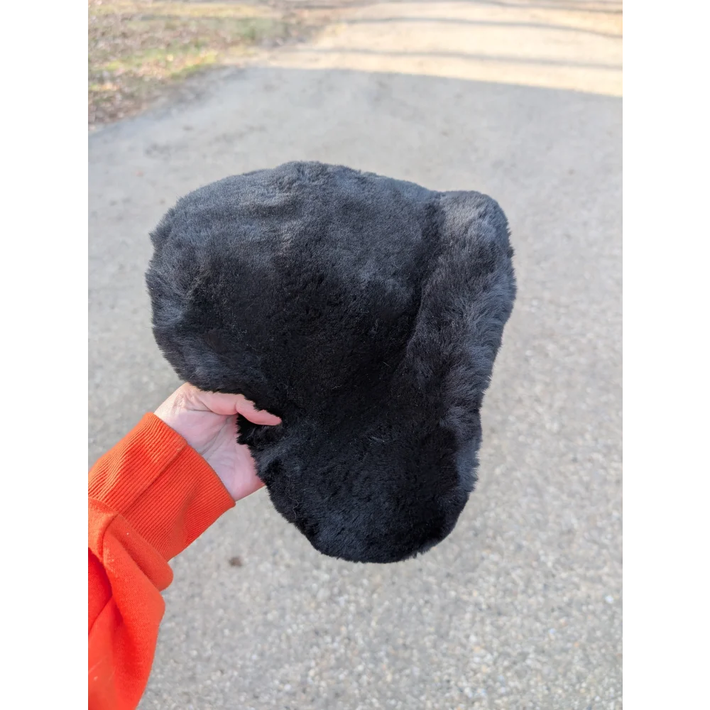 Cozy black fur sheepskin bicycle seat with plush ear flap hat