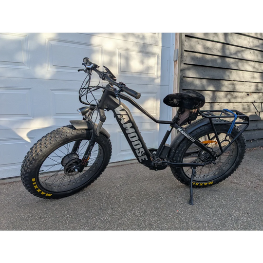 2019 fat tire e-bike with black frame, yellow wheels, and merino sheepskin bicycle seat