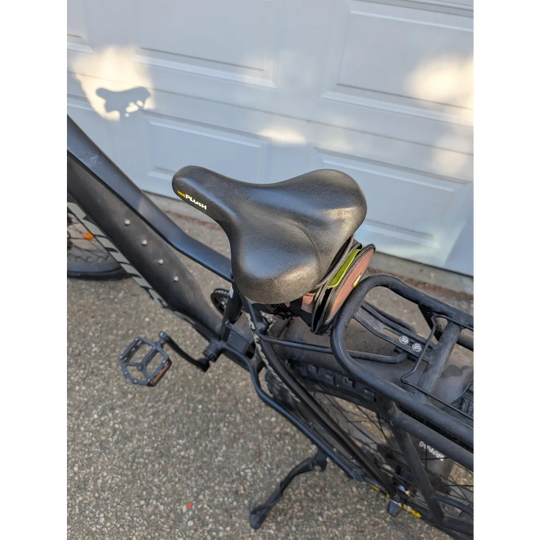 Comfortable sheepskin bicycle seat with black leather saddle, gel padding, and ergonomic design