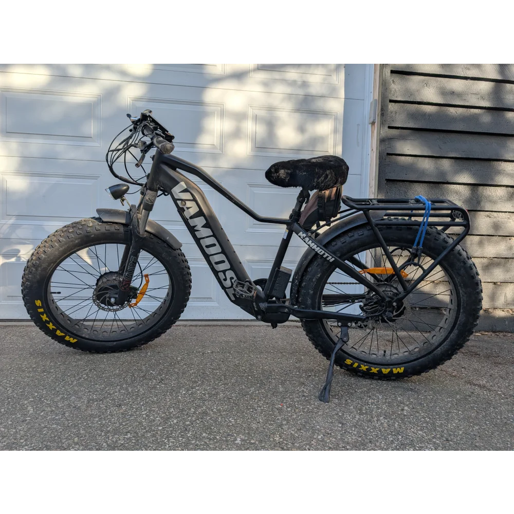 VanMoof S3 electric bike with sheepskin bicycle seat cover