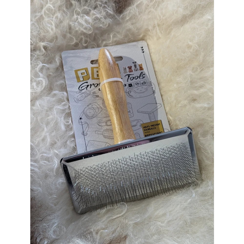 Silver sheepskin brush with gold handle and black bristles by Peb Tools