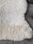 Soft fluffy cream sheepskin rug with Eucalan wash care pack