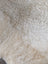 Cream faux fur throw with fluffy texture in Sheepskin Care Pack