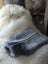 Gray sheepskin hot water bottle cover with plush fleece for chilly nights