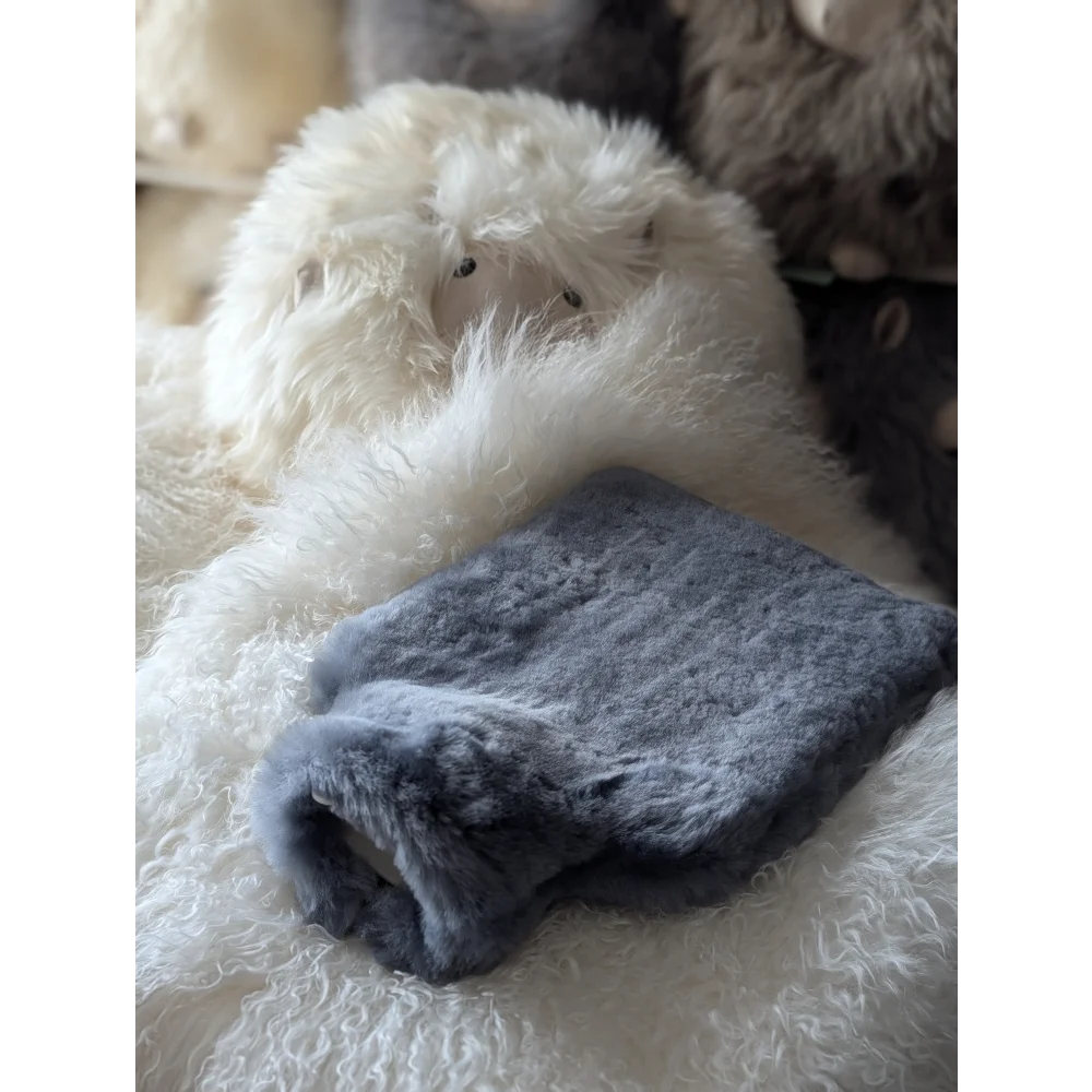 Soft plush gray sheepskin hot water bottle cover for chilly nights