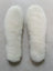 White fluffy sheepskin insoles made from Merino sheepskin for comfy sheepskin shoes
