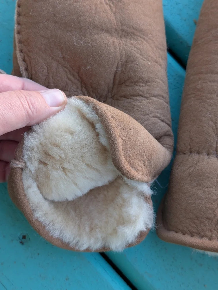 Tan sheepskin mittens with plush white fleece lining perfect for cozy winter mittens and sheepskin gloves use