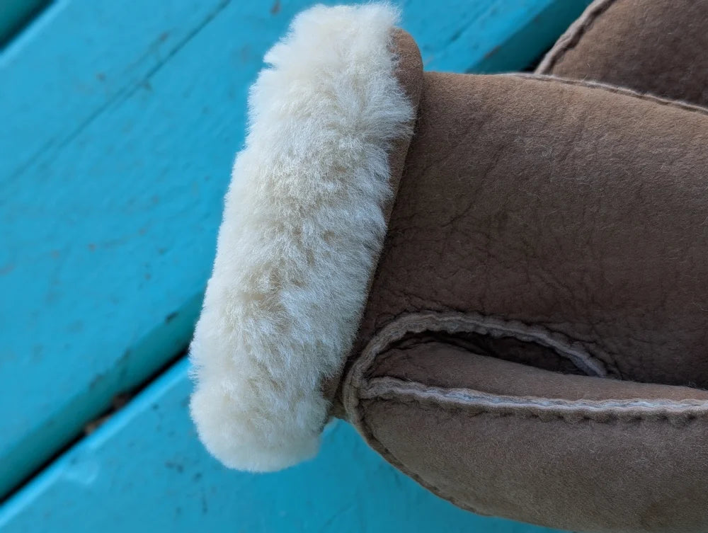 Brown sheepskin mittens with plush white fur lining perfect as warm winter mittens or sheepskin gloves