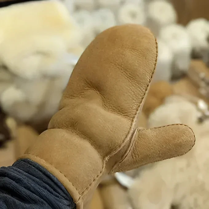 Cozy tan sheepskin mittens with fleece lining and thumb detail