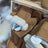 Cozy tan sheepskin mittens with white fur trim and round tag