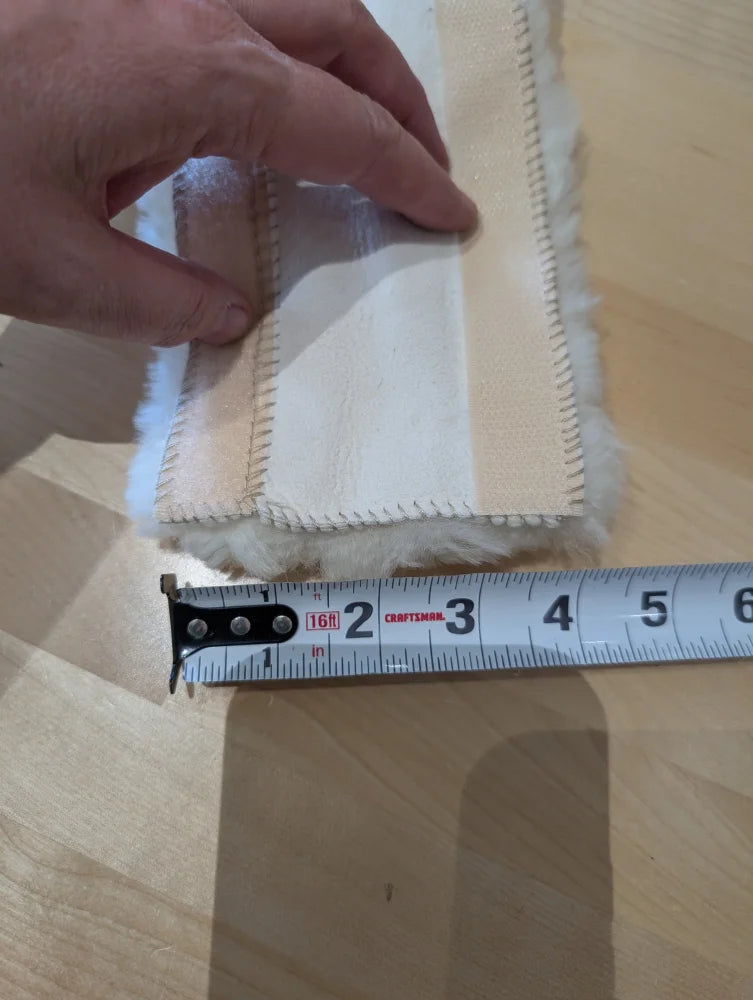 Sheepskin noseband cover with white cotton frayed edge and tape measure