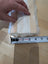 Sheepskin noseband cover with white cotton frayed edge and tape measure