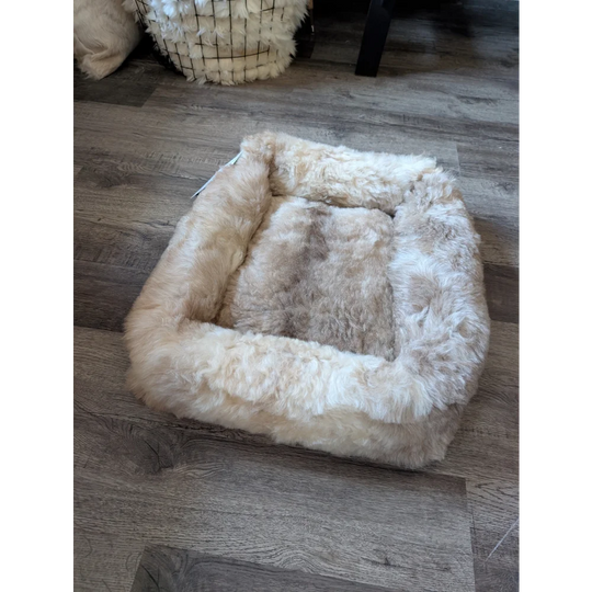 Cozy square highland sheepskin pet bed in cream wool, plush texture