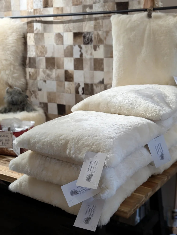 Cozy cream sheepskin pet bed stuffed with Canadian sheep’s wool