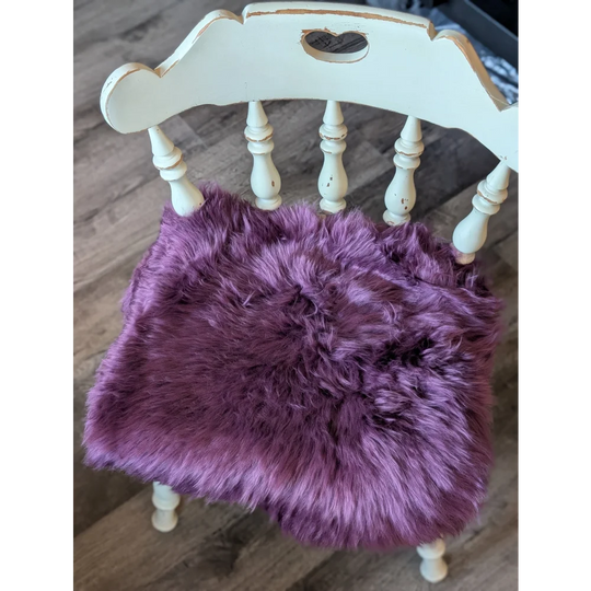 Plum purple lavender faux fur chair pad with heart cutout on white frame, eco friendly merino sheepskins