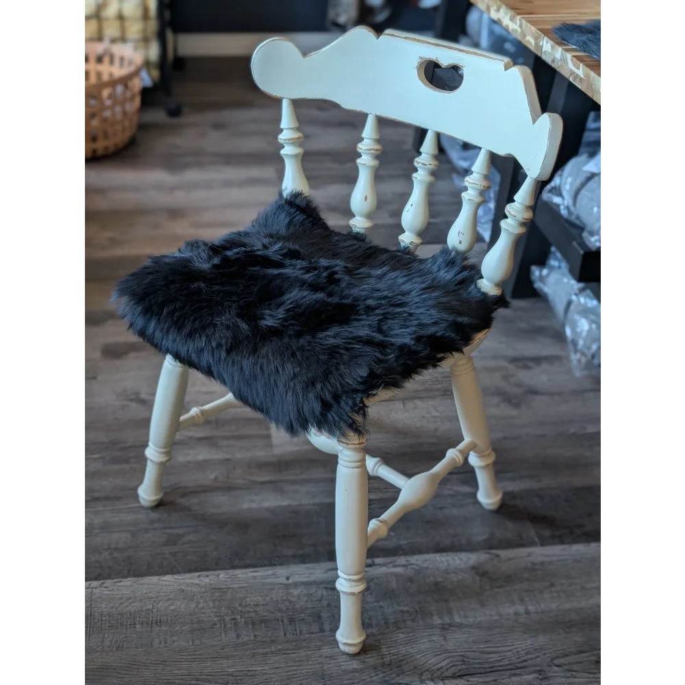 Gorgeous black merino sheepskin chair pad with heart cutout