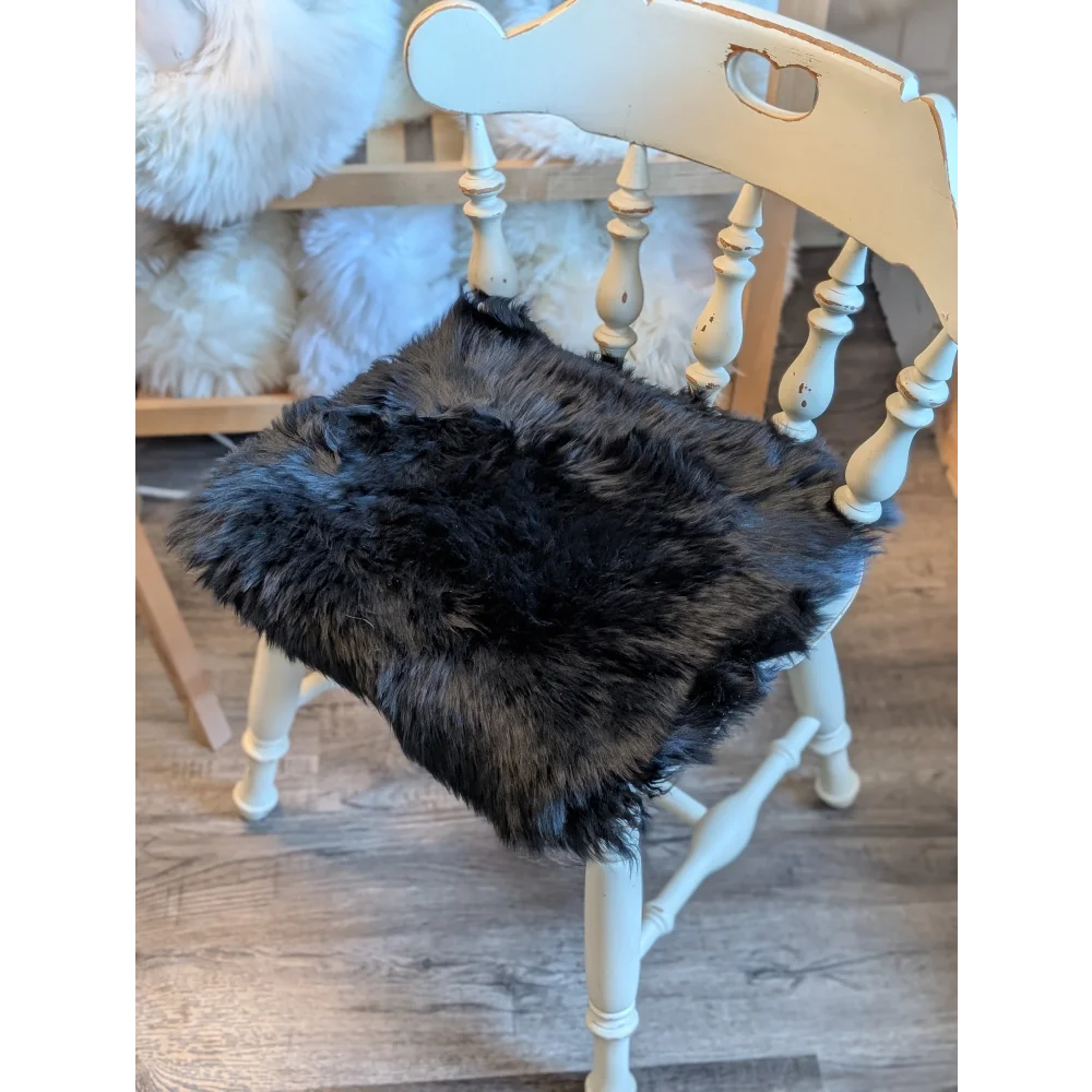 Gorgeous black merino sheepskin chair pad with heart cutouts, EU standards