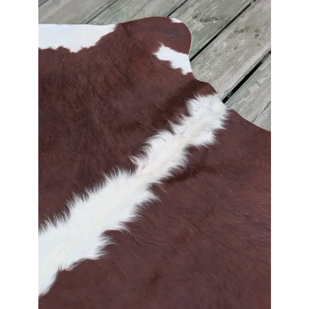 Large 85x74.5 cowhide rug with brown white patches and leather texture