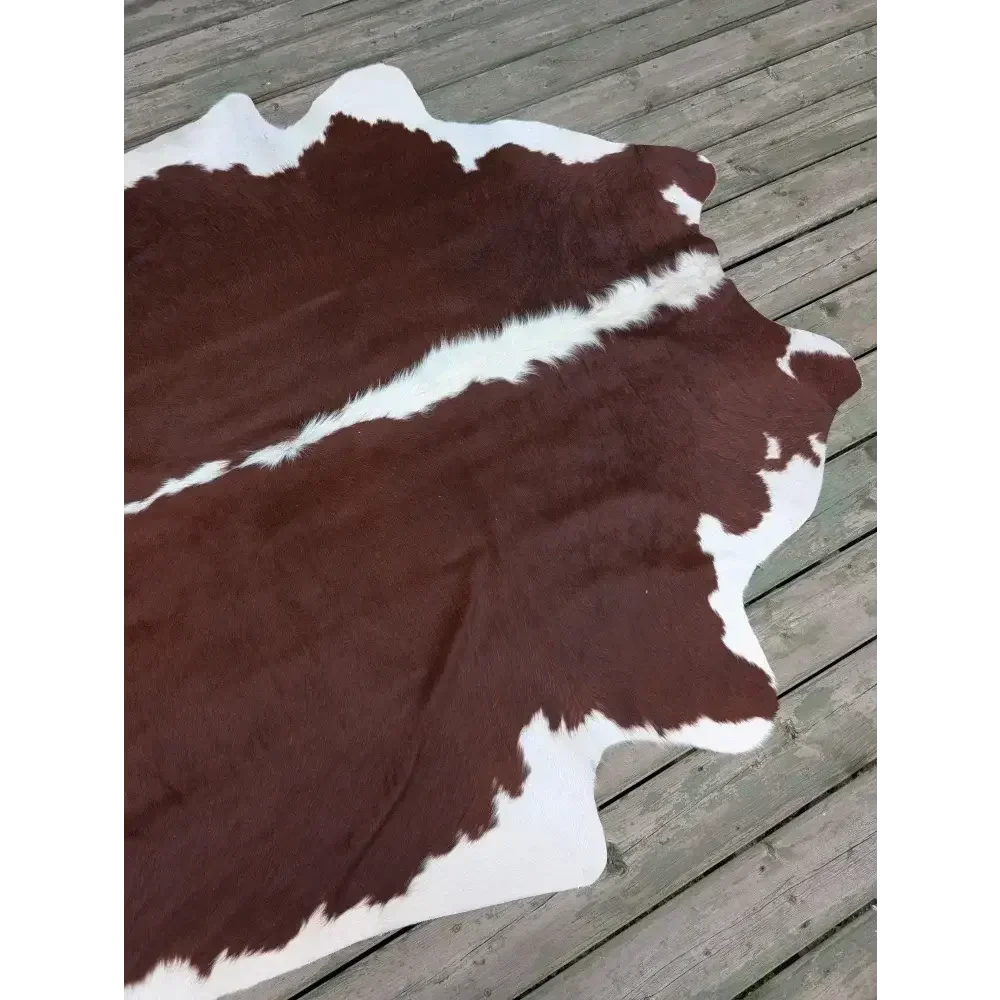 Large SM#34 cowhide rug with brown and white patches, 85x74.5 inches