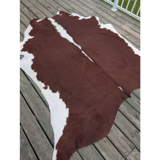 Large SM#34 cowhide rug with brown and white patches, 85 x 74.5 inches