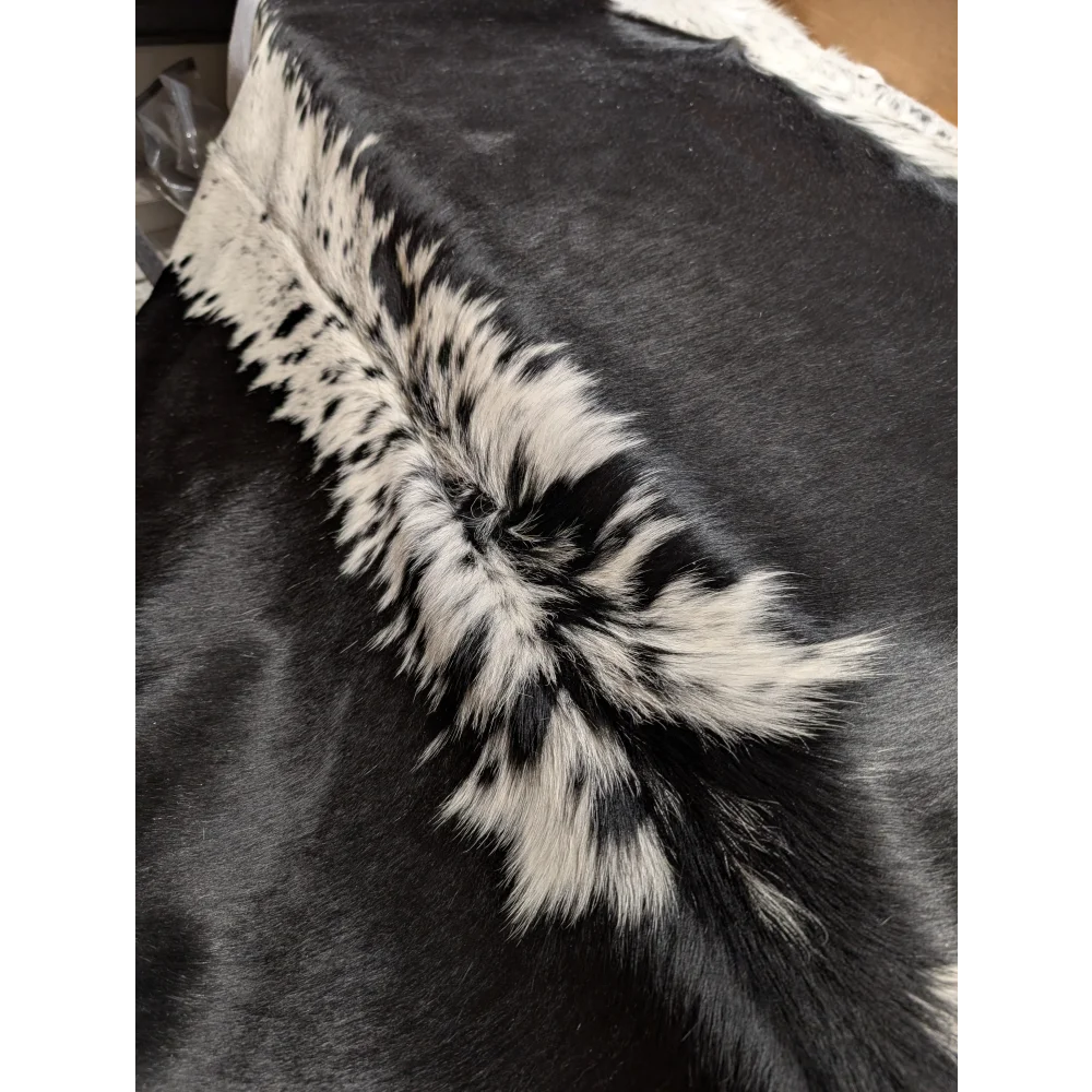 Large cowhide rug, soft underfoot, 85x75 inches