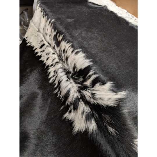 Large cowhide rug, soft underfoot, 85x75 inches