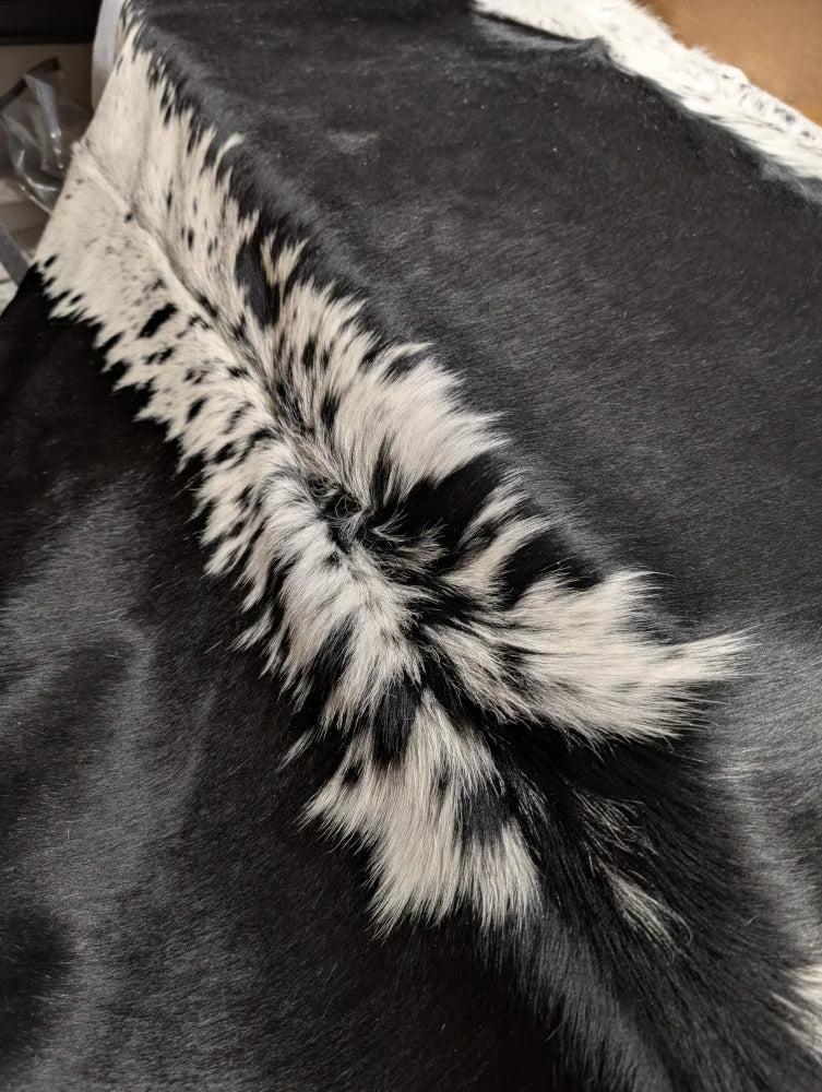 Large cowhide rug, soft underfoot, 85x75 inches