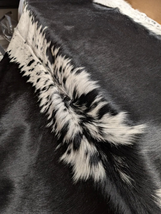 Large cowhide rug, soft underfoot, 85x75 inches