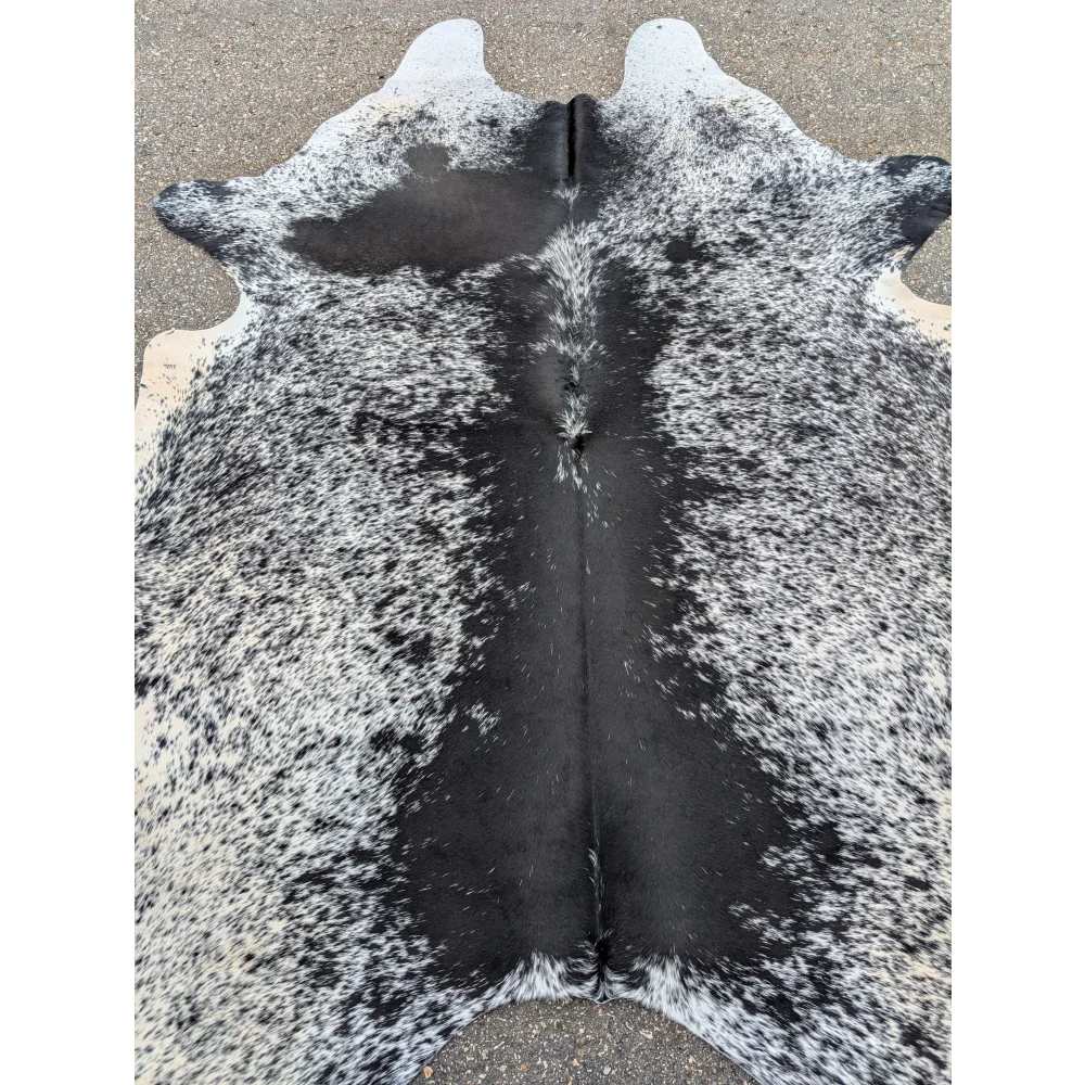 Black and white large cowhide rug with natural texture, perfect for your space