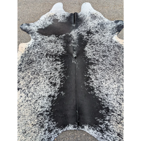 Black and white large cowhide rug with natural texture, perfect for your space