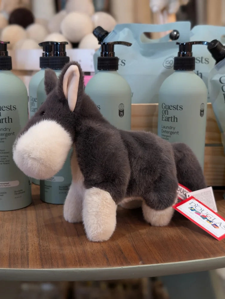 Snuggable wayne the wolf plush gray and white stuffed animal with soft fur standing on wooden surface perfect dachshund toy