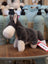 Snuggable wayne the wolf plush gray and white stuffed animal with soft fur standing on wooden surface perfect dachshund toy