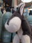 Snuggable wayne the wolf plush donkey toy with soft gray and white fur, black button eyes, perfect stuffed animal gift