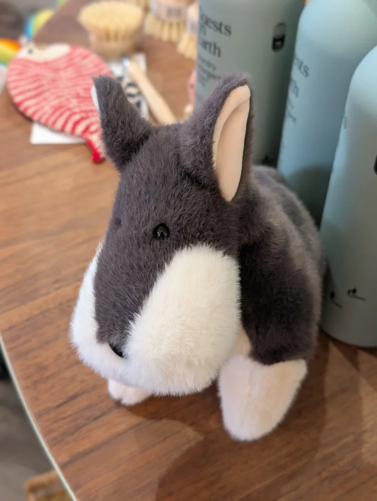 Snuggable wayne the wolf plush stuffed animal with soft gray and white fur and stitched black eyes for cozy cuddles