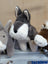 A plush gray and white donkey toy with soft fur and stitched nose from snuggable wolf dachshund toy collection