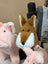 A plush so soft fox toy with brown and white fur, black button eyes, and a soft stitched nose perfect as a dachshund toy