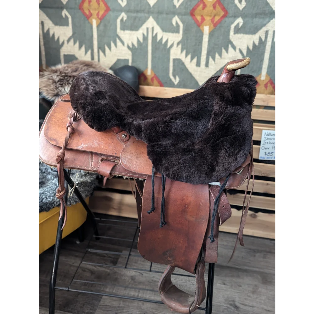 Brown merino sheepskin western saddle cover with silver hardware