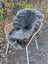 Gray faux fur british isles sheepskin throw blanket draped over wicker chair softbrit2 40 x 24 inches