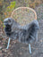 Gray faux fur chair cover draped over woven rattan chair with white metal legs softbrit 2 british isles sheepskin