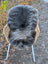 Softbrit#2 british isles sheepskin rug gray plush wool draped over wicker chair with white metal legs