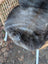 A softbrit#2 40 x 24 gray british isles sheepskin faux fur throw draped over a wicker chair