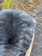 Softbrit2 gray plush british isles sheepskin blanket with natural texture in woven basket 40 x 24 inches