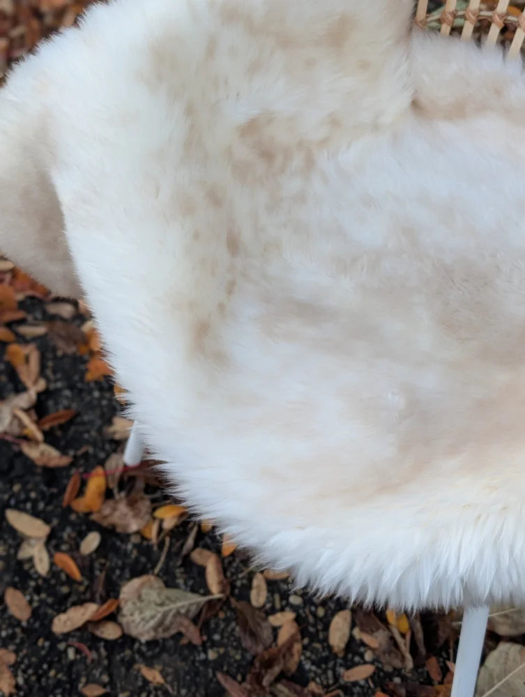 White faux fur chair cover with soft plush texture and mottled look from softbrit british isles sheepskin