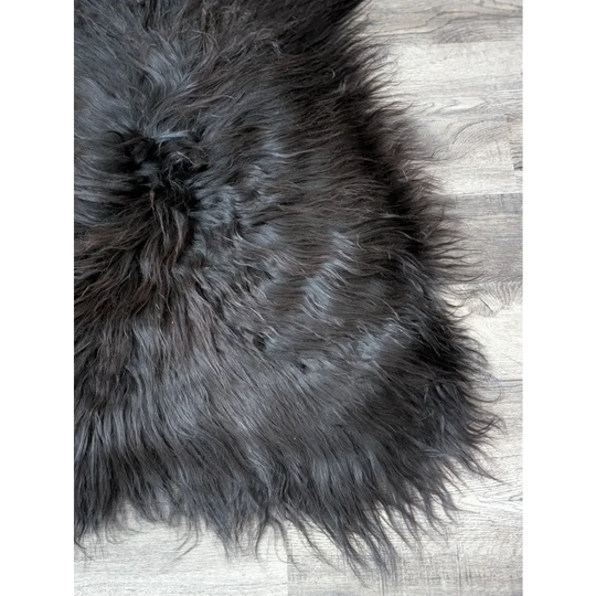 Massive 57x32 black Icelandic sheepskin rug with soft faux fur texture