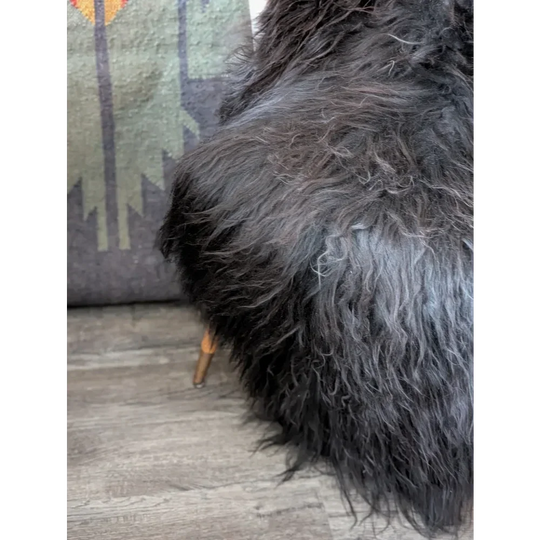 Massive 57x32 black Icelandic sheepskin rug with soft faux fur texture
