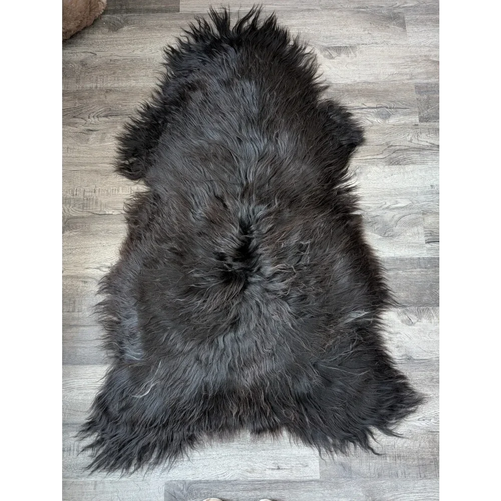 Massive 59x32 black Icelandic sheepskin rug with soft, thick fur